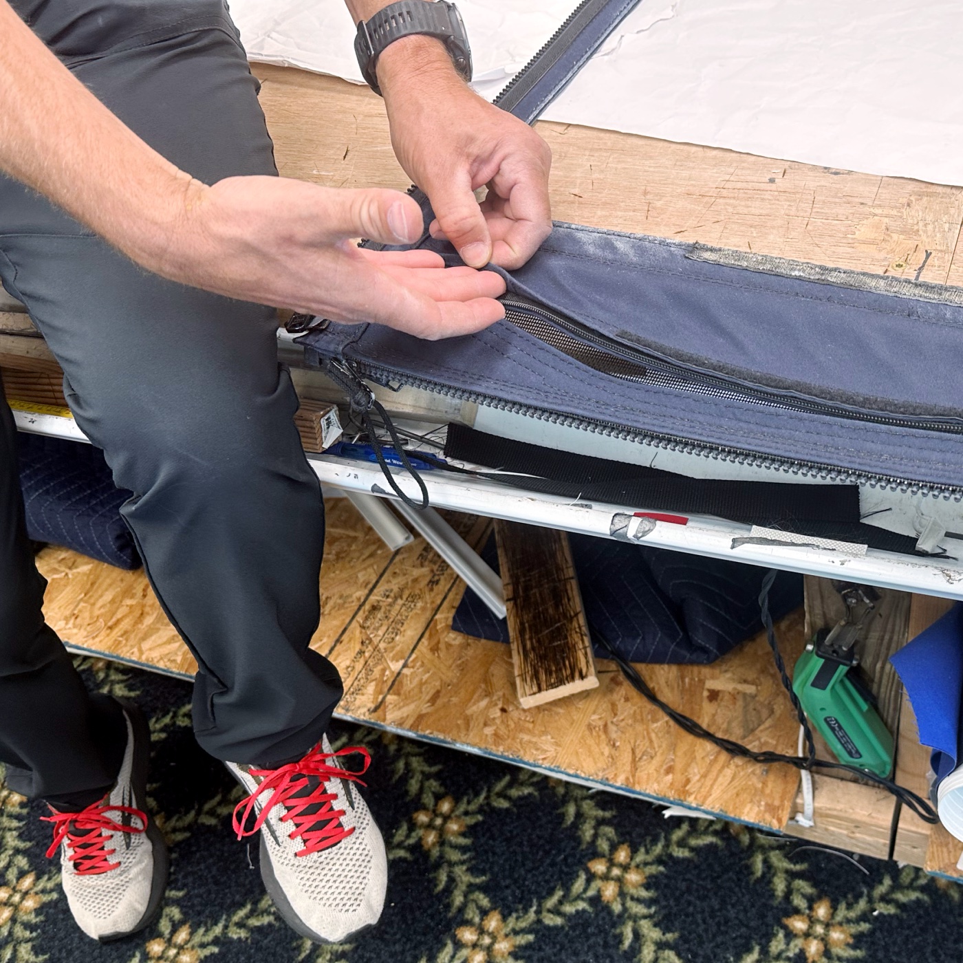 Examining a damaged piece of an enclosure panel