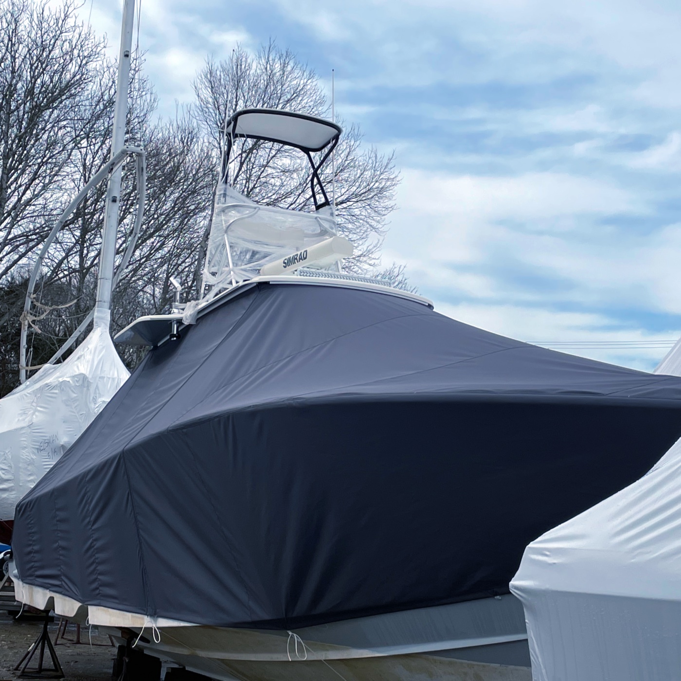 A boat on the hard with a winter cover